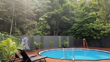 Seasonal outdoor pool, open 9:00 AM to 9:00 PM, pool loungers