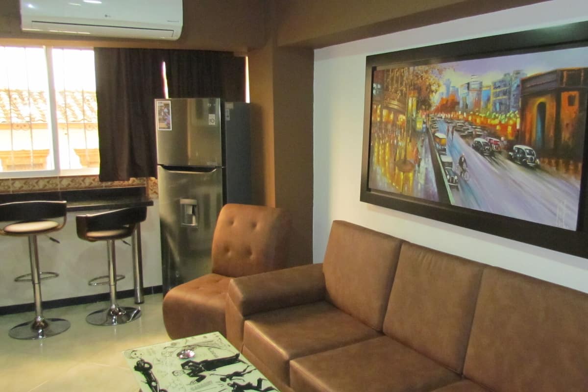 Classic Apartment | Living area | 32-inch flat-screen TV with cable channels, TV