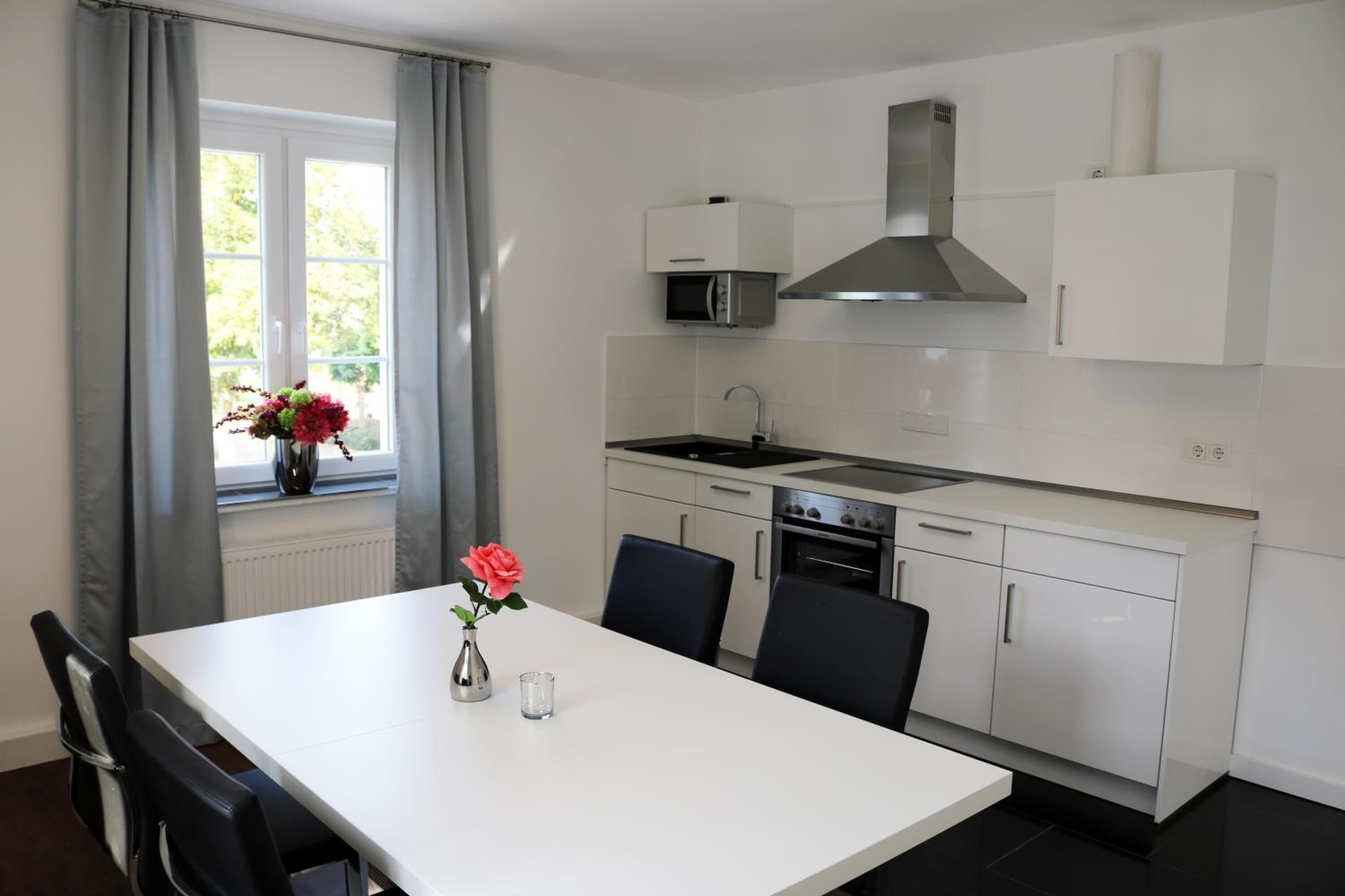 coffee/tea maker, electric kettle, dining tables