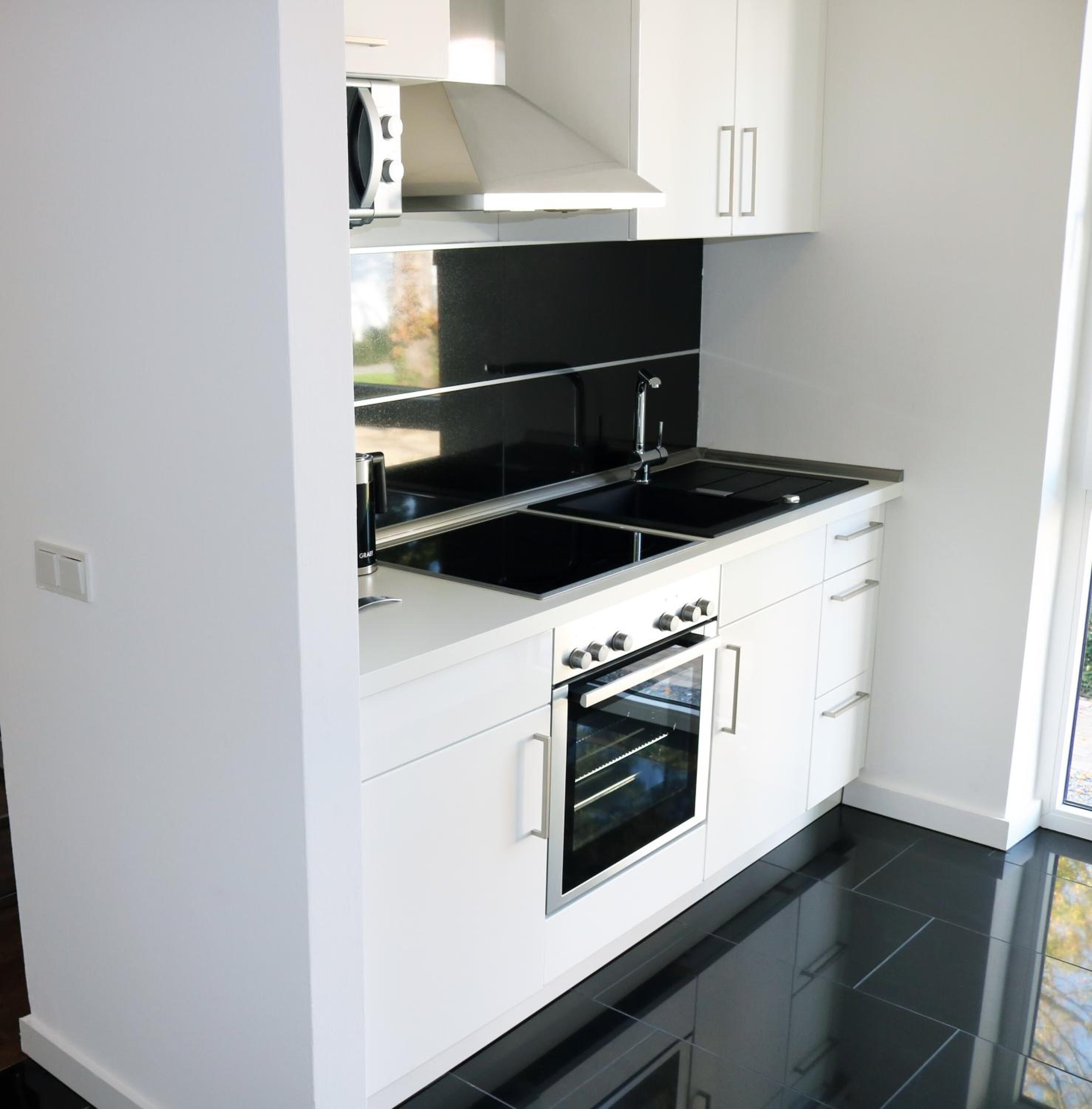 coffee/tea maker, electric kettle, dining tables