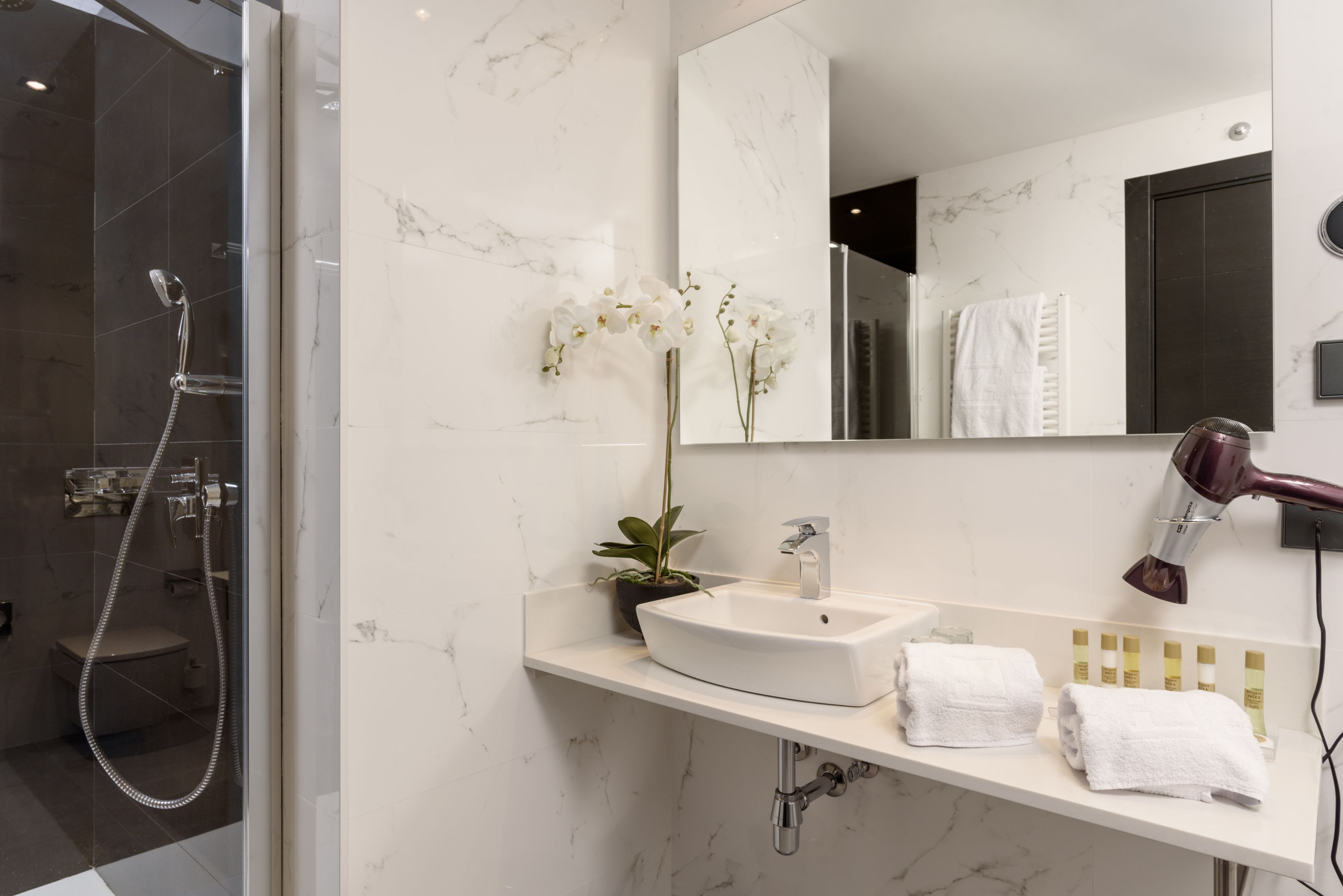 shower, eco-friendly toiletries, hair dryer, slippers