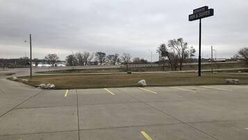 A parking lot with a sign for Denison Inn & Suites.