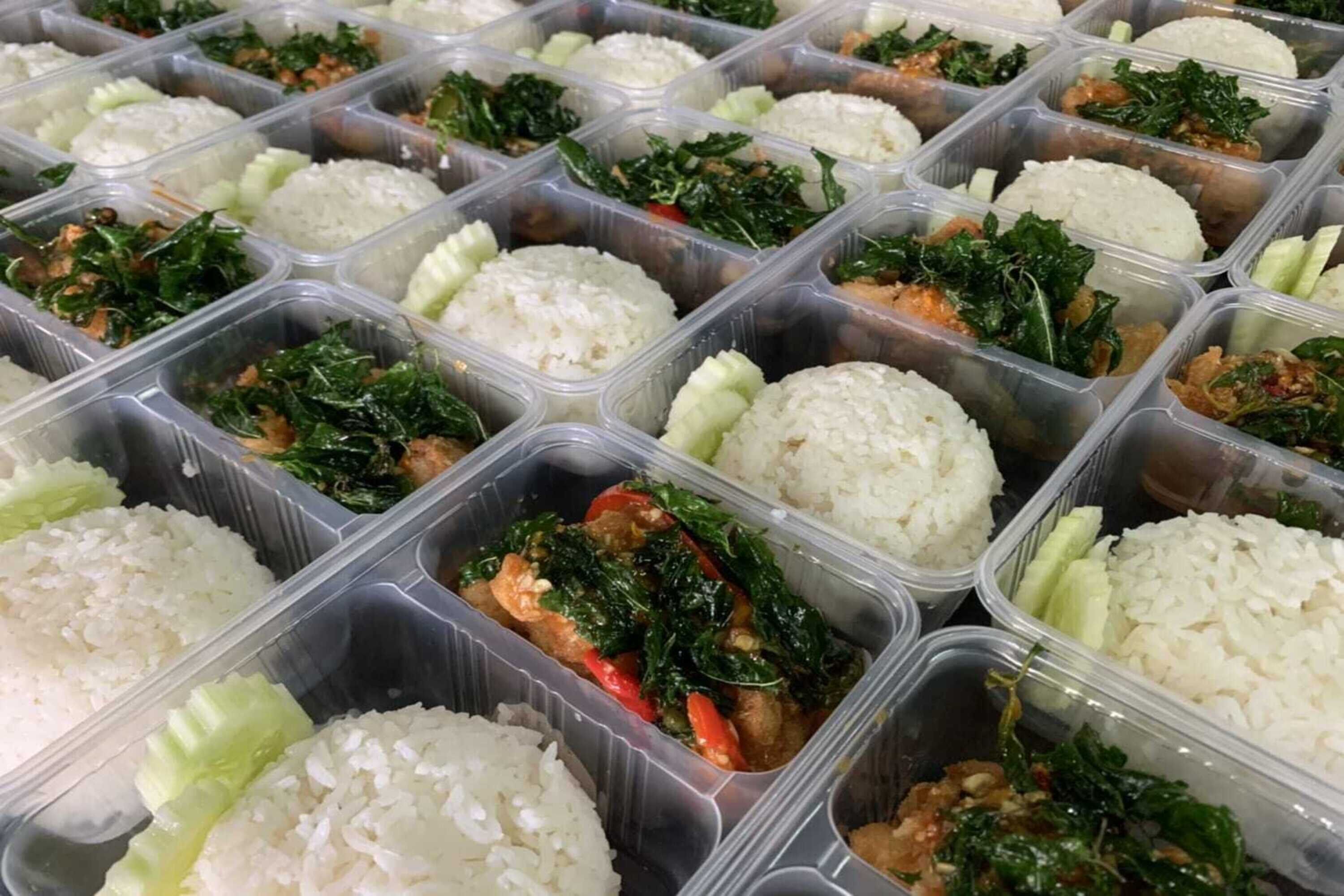 A variety of food containers with rice and vegetables.