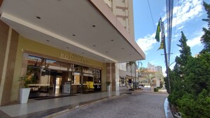 A hotel entrance with a sign reading "PRIVE BOULEVARD SUITE HOTEL".