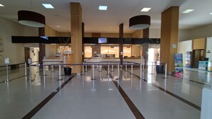 A spacious lobby with a reception desk, a waiting area, and a clear path for guests.