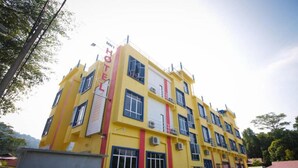 A multi-story yellow building with a sign reading "MY HOTEL". - MNY Hotel & Resort (Pangkor Island)