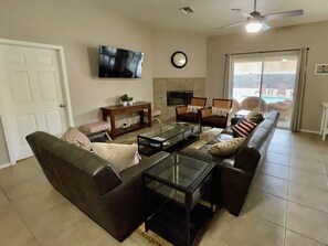 Smart TV, fireplace, books, offices