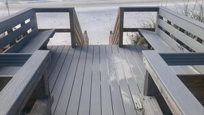 A wooden deck leading to a sandy beach with a view of the ocean. - 10 Star Reviews-BEACHFRONT Home, N Cape by State Park, Elevator, Screen Porch  (Cape San Blas)