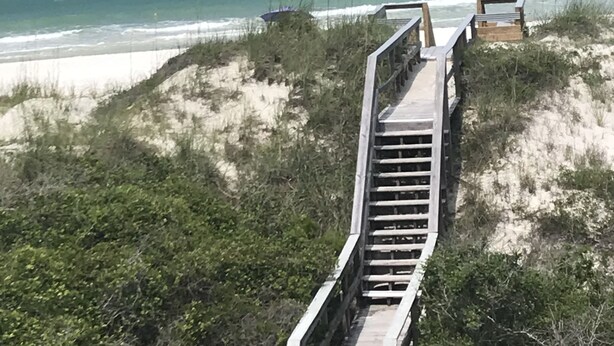 A wooden boardwalk leading to the beach with ocean views. - 10 Star Reviews-BEACHFRONT Home, N Cape by State Park, Elevator, Screen Porch  (Cape San Blas)