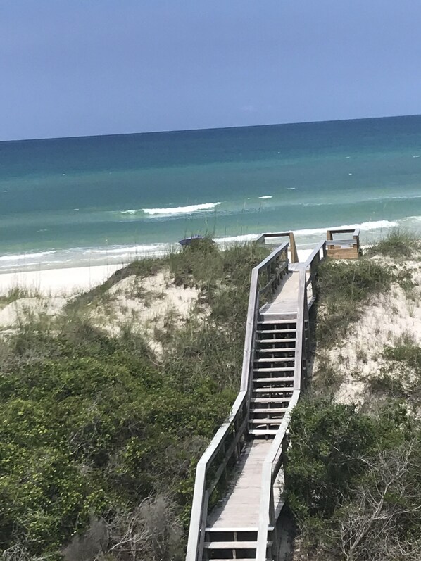 On the beach, sun-loungers