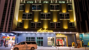 A hotel with a modern facade, large windows, and a prominent sign. - Asiatic Hotel (Malacca City)