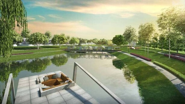 A serene park with a reflective pond, a wooden deck with seating, and a bridge. - New Wave Hotel Nilai 1 (Nilai)