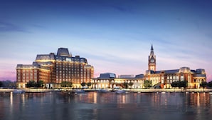 A large, historic building with a prominent tower and a waterfront view. - PRIMUS Hotel Wuhan Hannan (Wuhan)