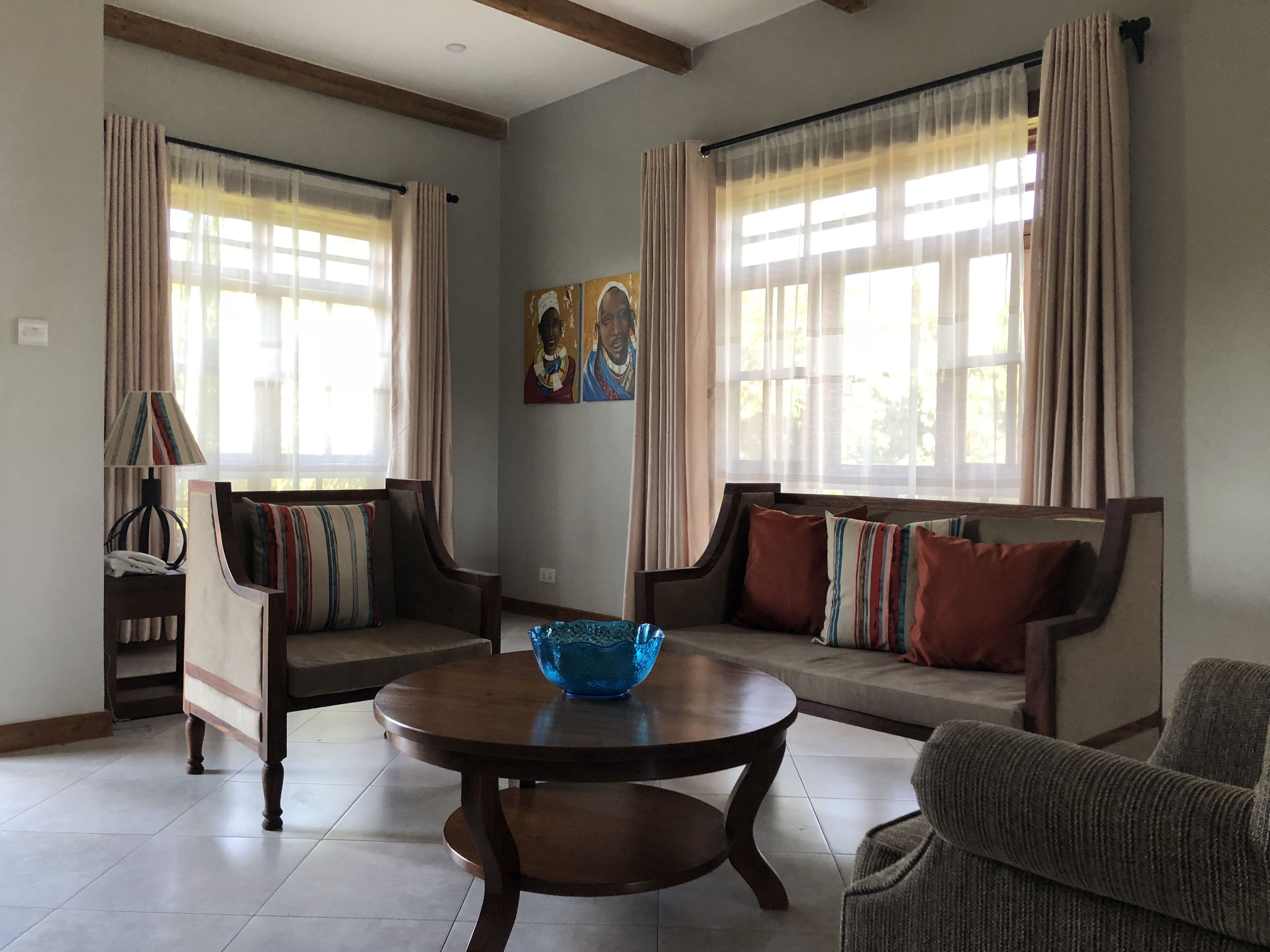 A living room with two sofas, a coffee table, and a lamp.