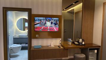 Family Triple Room | Minibar, in-room safe, desk, laptop workspace