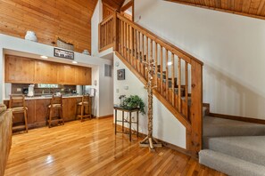 Step up to the upper level and enjoy meals or drinks at the bar with stools in this inviting lodge.