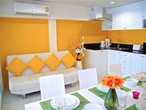 32-inch flat-screen TV with cable channels, TV, DVD player - Kata Plaza 1 bedroom Modern Apartment (Karon)