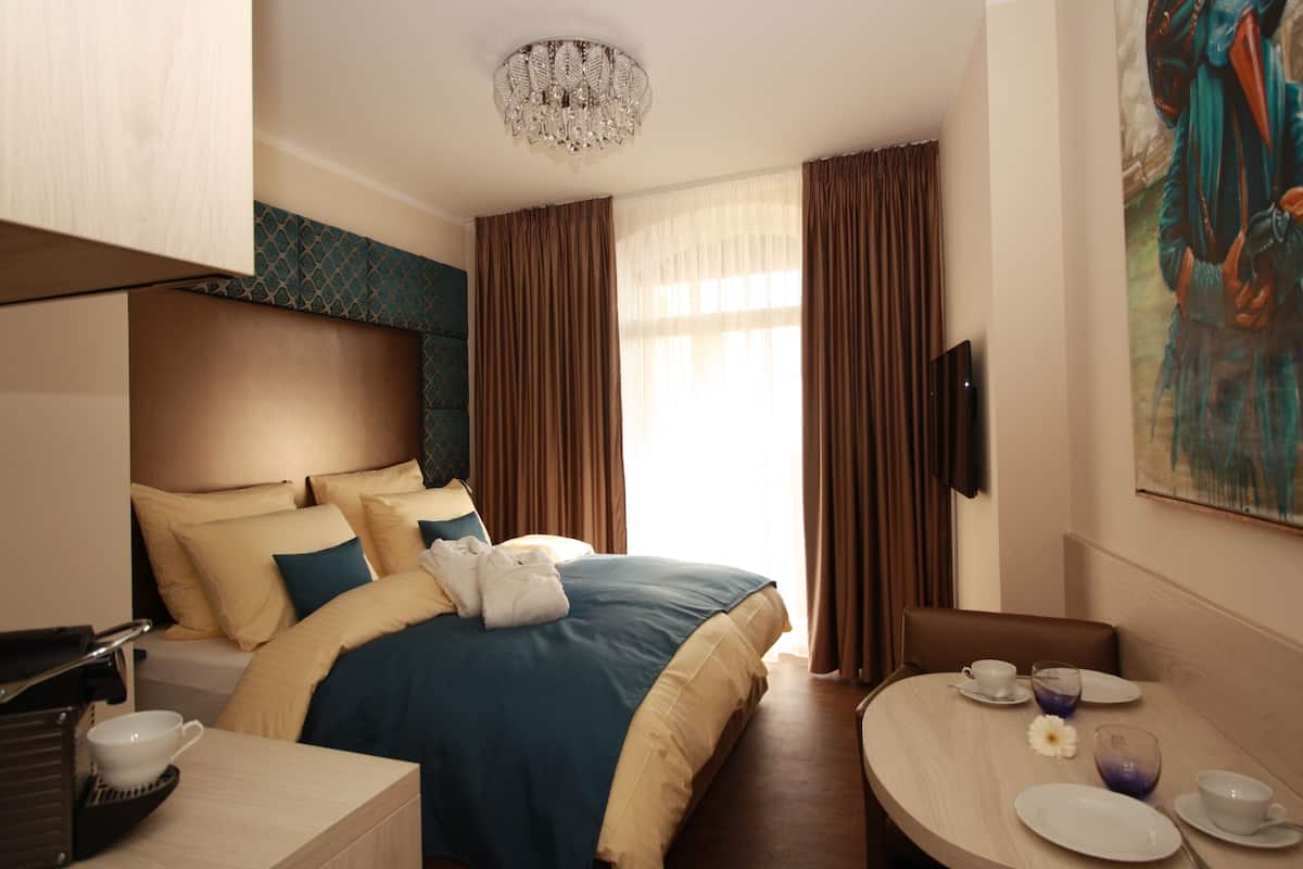 Signature Double Room, 1 King Bed, Balcony, Courtyard Area | Premium bedding, in-room safe, iron/ironing board, WiFi (free)