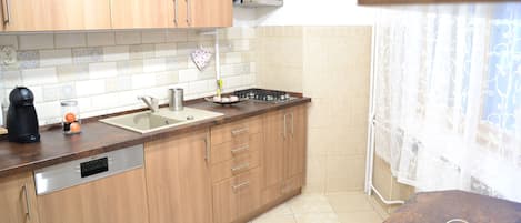 Family Apartment, 4 Bedrooms, Kitchen, Courtyard Area | Private kitchen | Full-sized fridge, microwave, stovetop, dishwasher