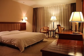 Minibar, desk, blackout curtains, iron/ironing board