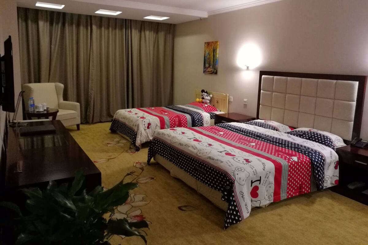 Minibar, desk, blackout curtains, iron/ironing board