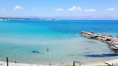 Playa privada, camas de playa gratis, sillas reclinables de playa