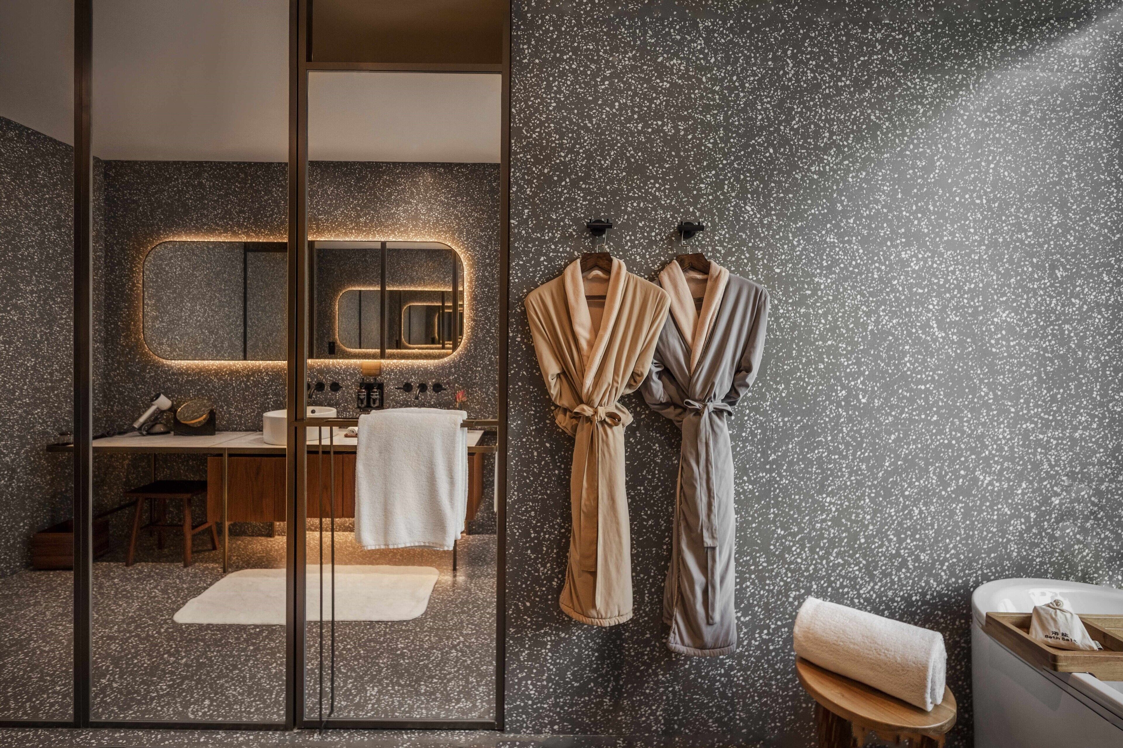 separate bathtub and shower, deep-soaking bathtub, rainfall showerhead