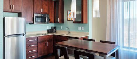 Premium bedding, desk, laptop workspace, iron/ironing board