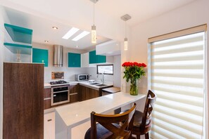 Superior Apartment, 2 Bedrooms | Private kitchen | Full-size fridge, microwave, oven, stovetop
