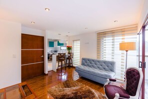 Superior Apartment, 2 Bedrooms | Living area | 32-inch flat-screen TV with satellite channels, TV