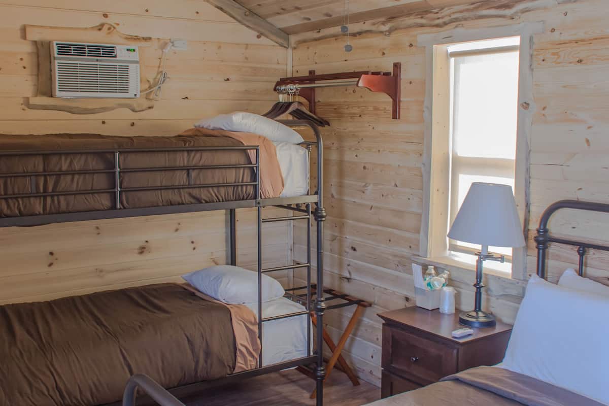 Premium Cabin, Multiple Beds, Patio, Mountain View | Cribs/infant beds, bed sheets