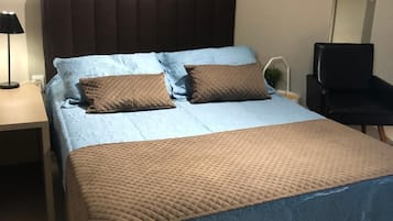 Roupas de cama premium, frigobar, Wi-Fi de cortesia, roupa de cama