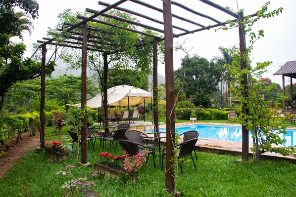 Outdoor pool, free pool cabanas, pool umbrellas