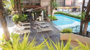 Outdoor pool, open 8:00 AM to 8:00 PM, sun loungers