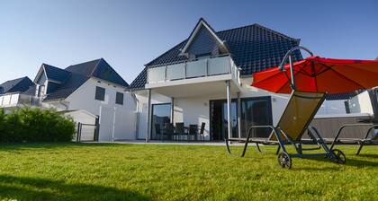 Villa Fleesenstrand am See | with outdoor whirlpool | Sky TV | Fireplace | sauna