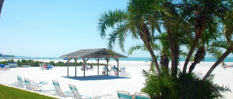 On the beach, sun loungers, beach towels