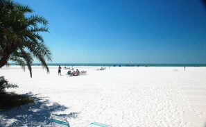 On the beach, sun-loungers, beach towels
