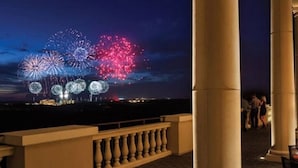 A balcony with a view of fireworks. - Reunion South facing pool home 3 bed/3.5 baths (Reunion)
