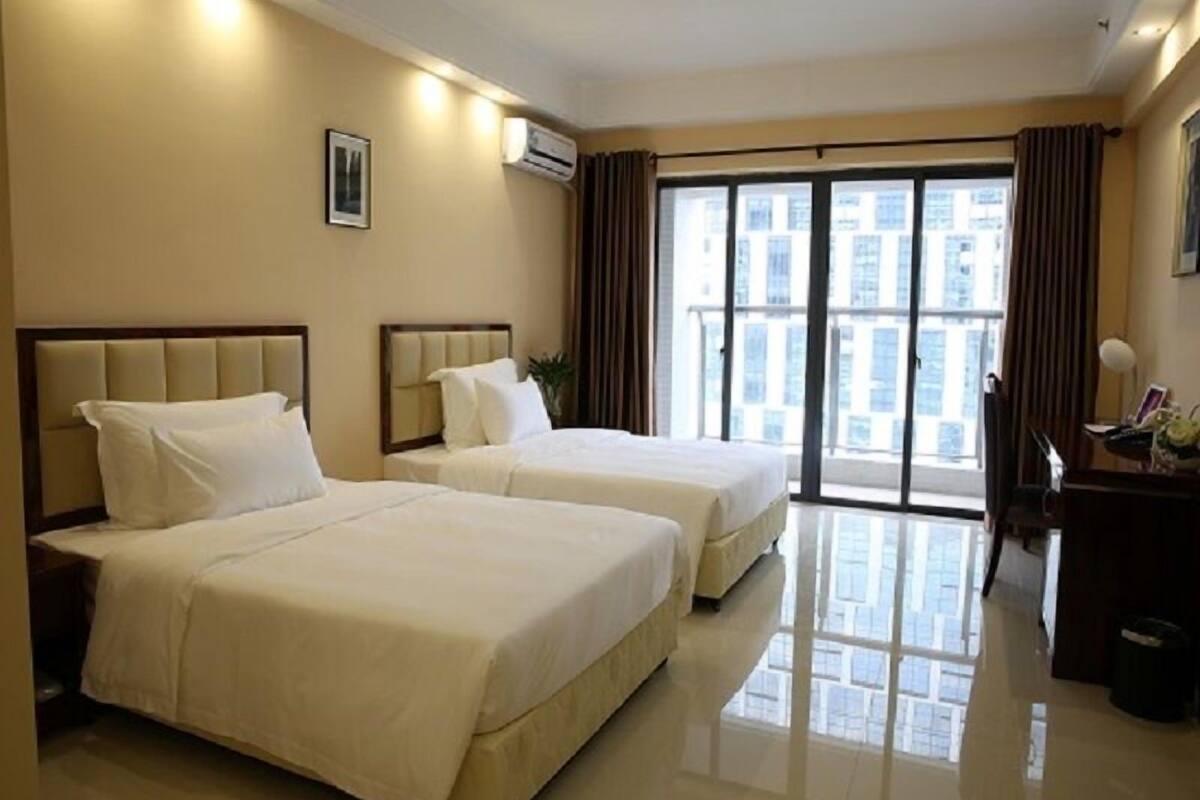 Chambre Deluxe avec lits jumeaux | Coffre-fort, bureau, rideaux d’obscurcissement