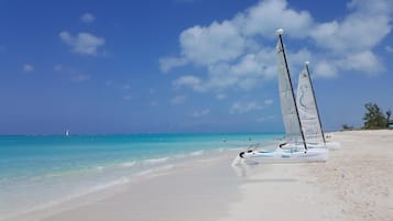 On the beach, sun loungers, beach towels