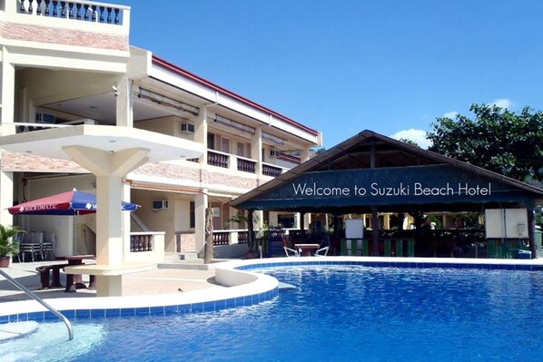 Outdoor pool, open 8 AM to 10 PM, pool umbrellas