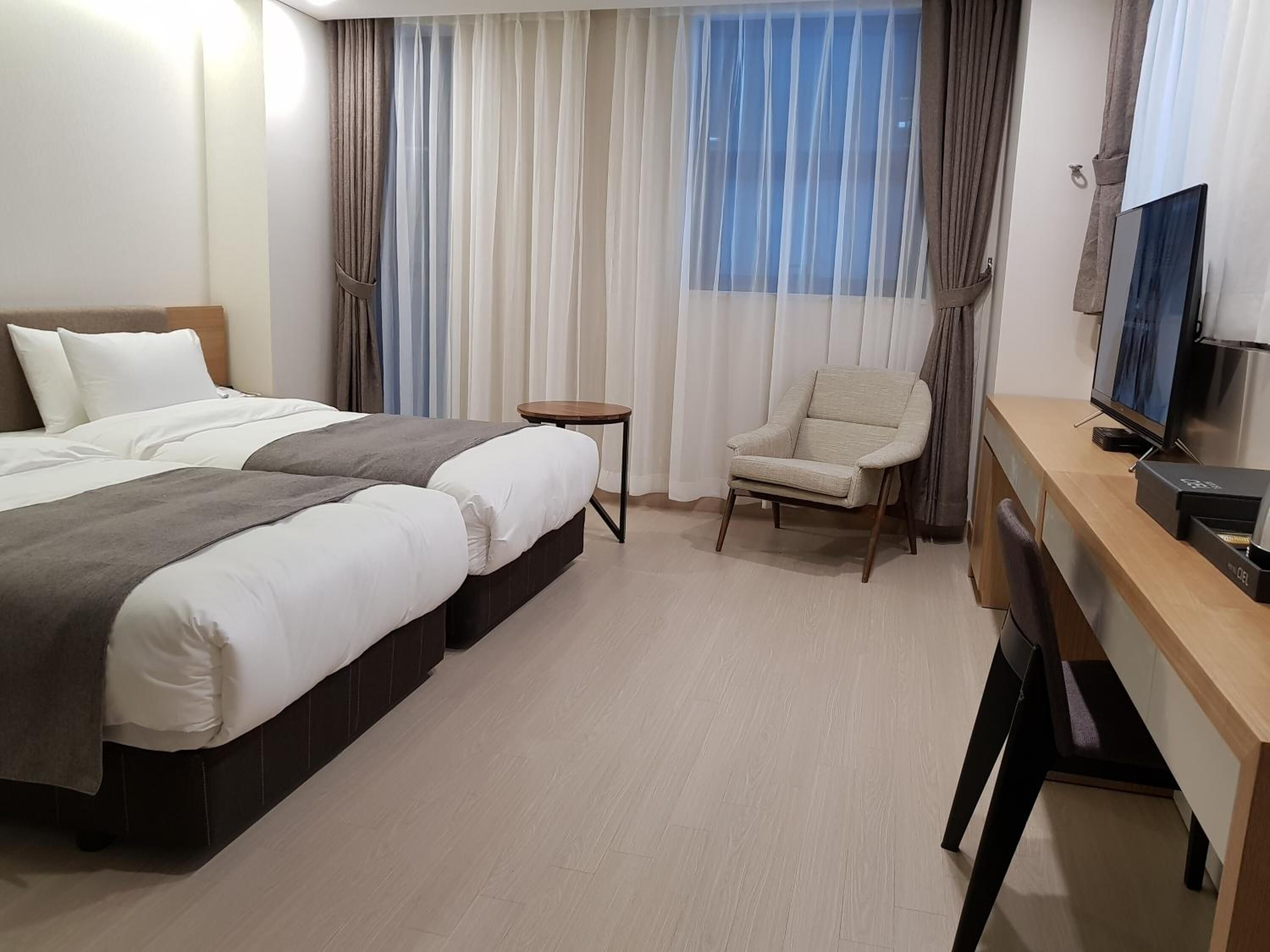 premium bedding, desk, blackout curtains, iron/ironing board