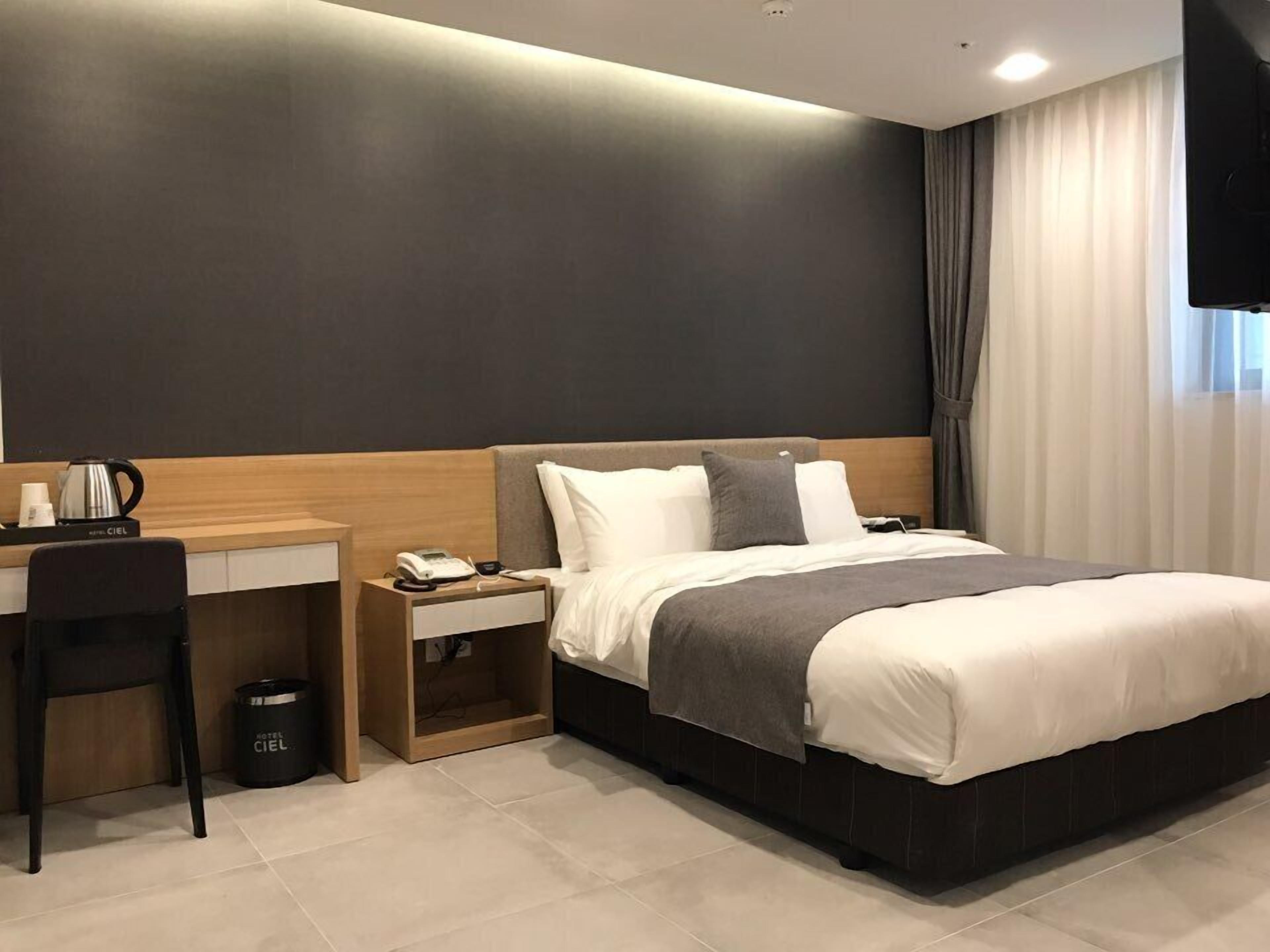 premium bedding, desk, blackout curtains, iron/ironing board