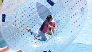 A transparent water slide with a person inside. - Park Hotel and Resort (Anekal)