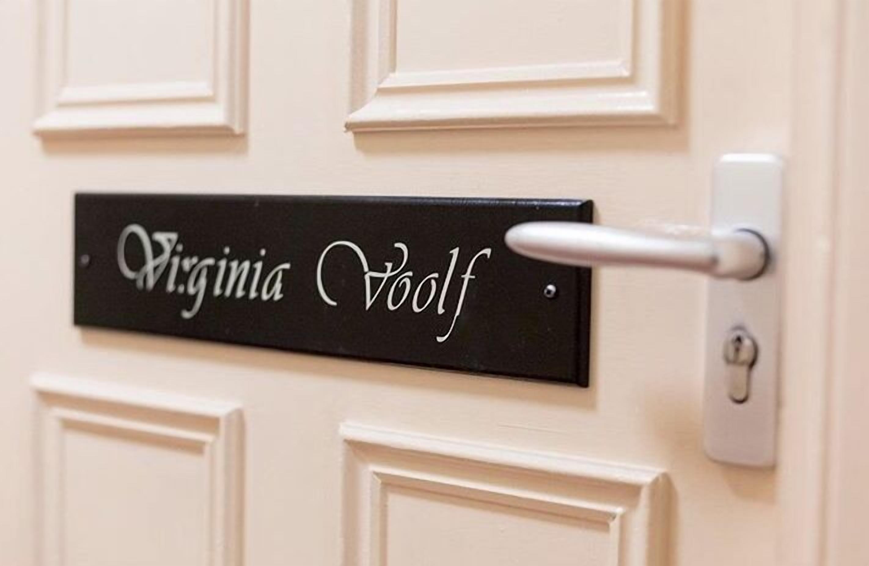 A door with a nameplate reading "Virginia Voelf" and a door handle.