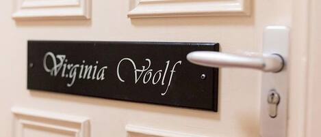 A door with a nameplate reading "Virginia Voelf" and a door handle.