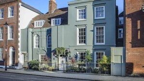 A row of traditional terraced houses with a uniform architectural style, featuring symmetrical windows and a consistent facade. - Ye Spotted Dogge (Portsmouth)