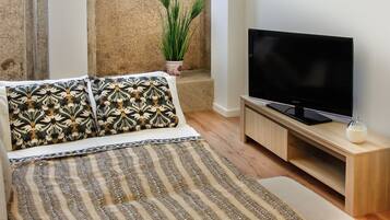 Apartment, 1 Bedroom | Living room | Flat-screen TV