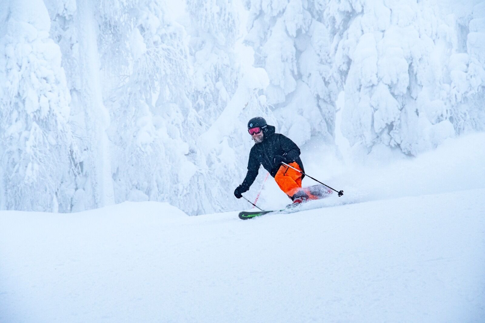A person skiing down a snowy slope.