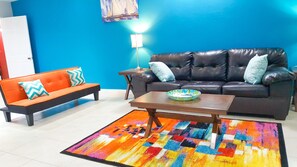 Superior Apartment, 2 Bedrooms, Ground Floor | Living area | 50-inch flat-screen TV with cable channels, TV, DVD player - Casa Clayton at Donhead - New Kingston (Kingston)